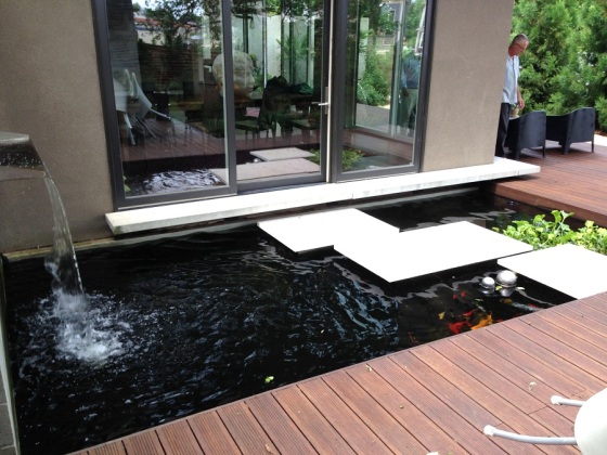 Tranquil bamboo deck alongside a Zen inspired water feature. Photo courtesy Dasso XTR.